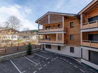 Experience modern alpine living in this stunning wooden apartment building.