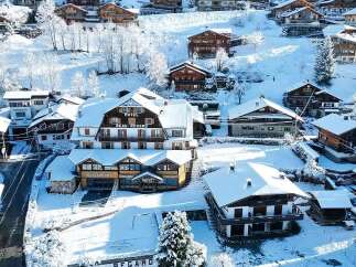Experience the charm of a winter wonderland at this picturesque hotel nestled in a snowy mountain village.