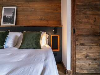 Experience rustic charm and modern comfort in this inviting bedroom.