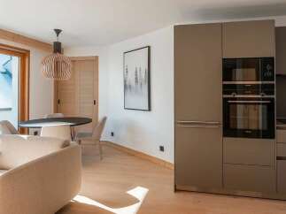 Experience modern living in this beautifully appointed apartment, featuring a sleek, integrated kitchen with state-of-the-art appliances.