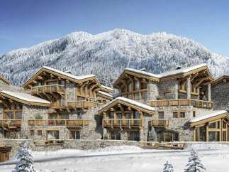 Experience luxury mountain living in this stunning chalet, featuring exquisite stone construction and warm wooden accents.