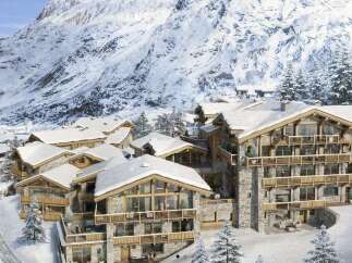 Experience luxury mountain living in this stunning chalet-style property, nestled amidst snow-capped peaks.