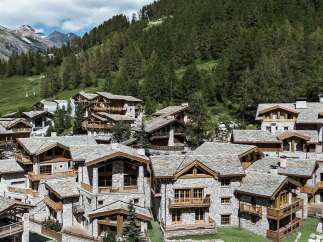 Discover luxurious alpine living in this stunning collection of chalets nestled amidst the majestic mountains.