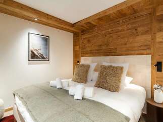 Experience rustic charm and modern comfort in this beautifully appointed bedroom.
