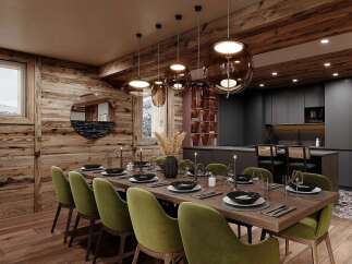 Experience luxurious mountain living in this stunning dining room, featuring a rustic wooden interior complemented by modern dark cabinetry in the adjacent kitchen.