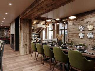 Experience luxury mountain living in this stunning dining room, featuring a rustic wooden ceiling and walls that exude warmth and alpine charm.