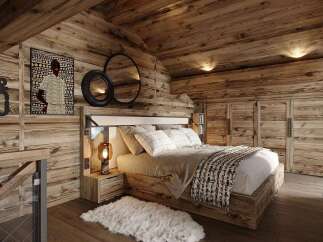 Experience rustic luxury in this charming wooden bedroom, featuring a cozy bed adorned with plaid pillows and a patterned throw.
