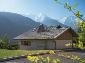 Experience serene mountain living in this charming chalet, perfectly situated with breathtaking views of snow-capped peaks.