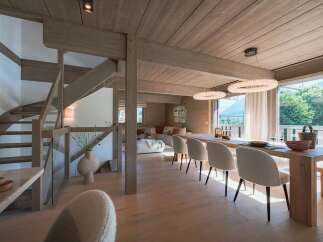 Experience luxury mountain living in this stunning open-concept dining and living area.