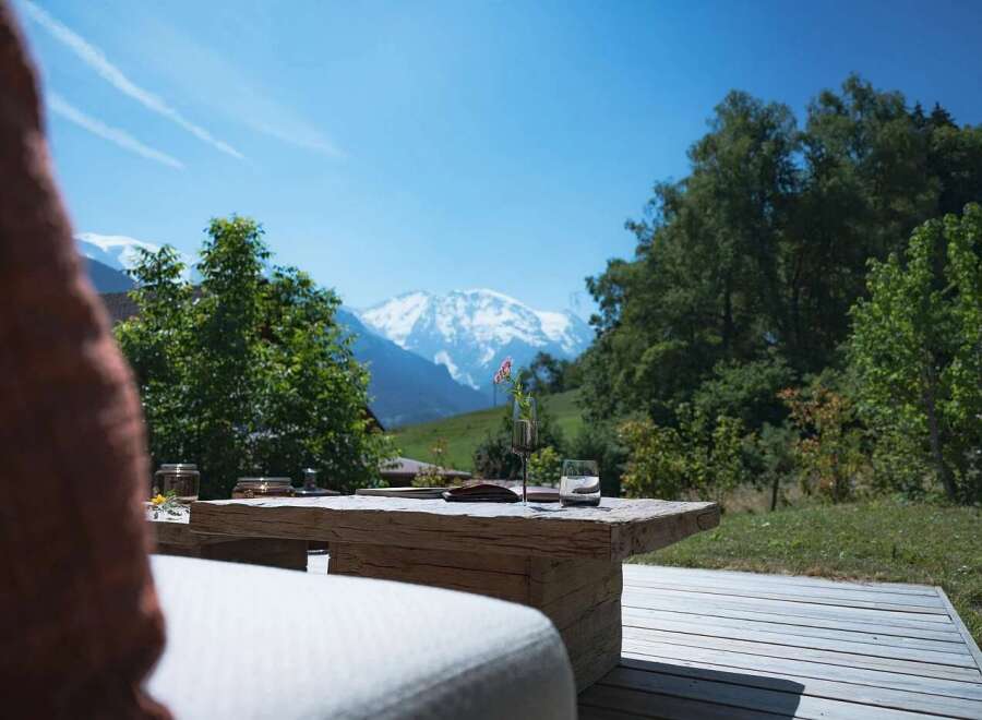 Enjoy breathtaking mountain views from this stunning outdoor seating area.