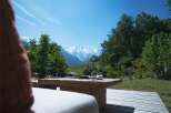 Enjoy breathtaking mountain views from this stunning outdoor seating area.
