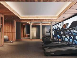 Experience ultimate wellness in this modern home gym, featuring state-of-the-art treadmills and a serene mountain mural.