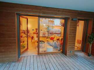 Experience modern living with this stunning property featuring a spacious living area and a comfortable bedroom, both seamlessly connected to an outdoor deck.
