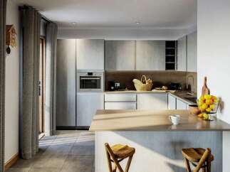 Step into this modern kitchen, featuring sleek, light-toned cabinetry and a built-in oven for a seamless look.