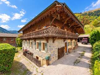 Experience rustic charm in this traditional wooden chalet nestled in a picturesque mountain setting.