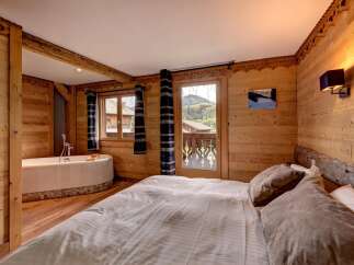 Experience rustic charm and modern comfort in this beautifully appointed bedroom.