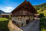 Experience the charm of this traditional wooden chalet nestled in a picturesque mountain landscape.