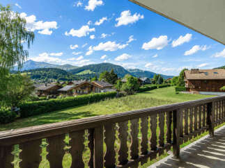Experience breathtaking mountain views from this charming property, nestled amidst lush greenery and traditional chalets.