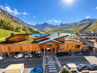 Discover this stunning modern property nestled in a breathtaking mountain landscape with a serene lake view.