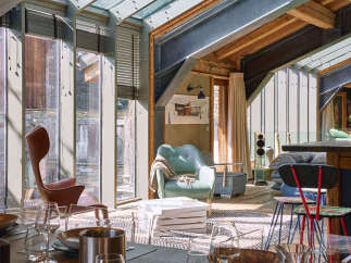 Experience luxurious living in this stunning mountain retreat, featuring a unique blend of rustic charm and modern industrial design.