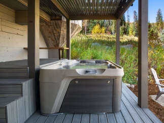 Experience ultimate relaxation in this luxurious hot tub, perfectly situated on a spacious deck.