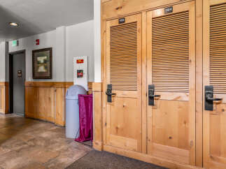 Discover the charm of this property featuring beautifully crafted wooden doors with louvered panels, perfect for storage or closets.
