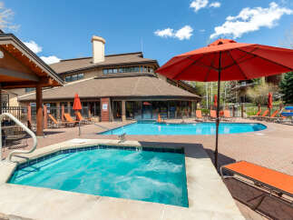Enjoy a refreshing dip in the sparkling blue pool or relax in the bubbling hot tub at this stunning property.