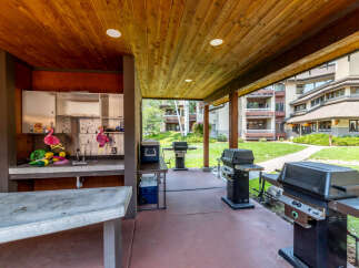 Enjoy outdoor living at its finest with this spacious covered patio, perfect for entertaining.