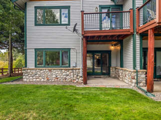 This charming home features a unique stone foundation and a spacious deck perfect for outdoor entertaining.