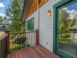 Enjoy outdoor living on this charming deck, perfect for relaxing or entertaining.