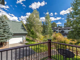 Enjoy the stunning mountain views from this beautiful property, featuring a spacious deck perfect for outdoor relaxation.