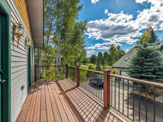 Enjoy the stunning mountain views from this spacious deck, perfect for outdoor entertaining or simply relaxing in the fresh air.
