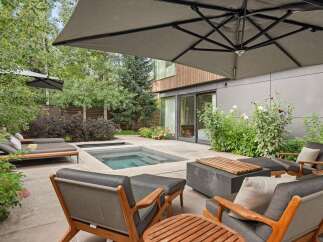 Experience ultimate relaxation in this modern backyard oasis, featuring a sleek plunge pool and spa perfect for unwinding.