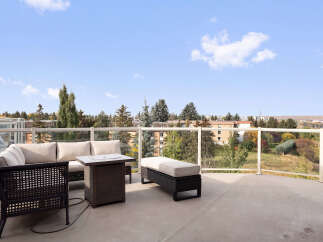 Enjoy breathtaking views from this spacious balcony, perfect for outdoor entertaining.