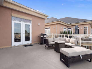 Enjoy outdoor living on this spacious patio, perfect for entertaining guests or relaxing with family.