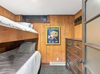 This cozy room features a space-saving bunk bed, perfect for accommodating guests or family.