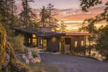 Experience modern luxury in this stunning contemporary home, nestled amidst lush trees with breathtaking ocean views.