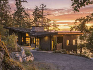 Experience modern luxury in this stunning contemporary home, nestled amidst lush trees with breathtaking ocean views.