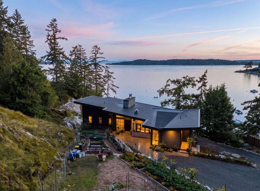 Experience modern living with this stunning contemporary home nestled on a picturesque waterfront property.