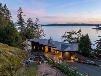 Experience modern living with this stunning contemporary home nestled on a picturesque waterfront property.