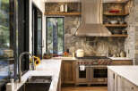 Experience rustic elegance in this stunning kitchen, featuring a striking stone accent wall that adds warmth and texture.