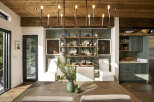Experience rustic charm and modern elegance in this dining area, featuring a warm wooden ceiling and exposed beams.