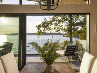 Experience breathtaking waterfront living in this stunning modern home.