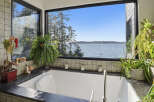 Indulge in ultimate relaxation with this stunning bathroom featuring a luxurious soaking tub.