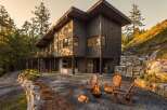 Experience modern luxury in this stunning contemporary home nestled amidst a serene forest landscape.