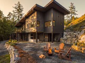 Experience modern luxury in this stunning contemporary home nestled amidst a serene forest landscape.