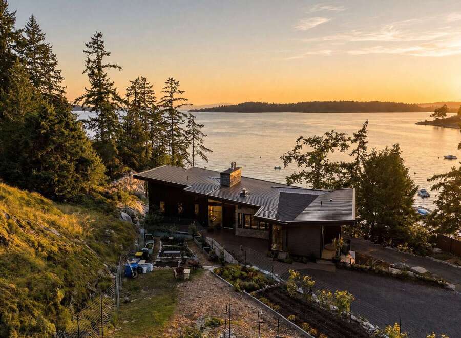 Experience breathtaking sunset views from this modern architectural masterpiece nestled on a secluded waterfront property.