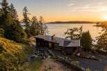 Experience breathtaking sunset views from this modern architectural masterpiece nestled on a secluded waterfront property.