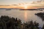 Experience breathtaking sunset views over the tranquil waters from this stunning coastal property.