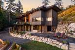 Experience modern luxury in this stunning hillside home, featuring expansive windows and a multi-level design that maximizes natural light and scenic views.